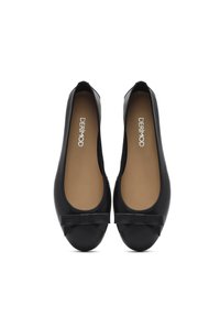 Black ballet flats with a rounded toe, a small bow accent at the front, and a smooth leather finish. Tan insoles are visible inside.