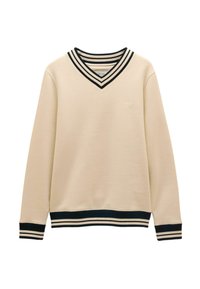 Ilgos kremiškos rankovės megztinis su juodais ir kreminiais dryžuotais V formos iškirpimu, rankogaliais ir apačia, su subtiliu siuvinėtu logotipu kairiajame krūtinės plote.