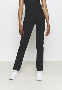 Black pants with a tailored fit, made of lightweight material. Features zippered pockets and ankle zippers for ease of wear.