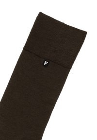 Brun strikket sok med en ribbet manschet. Har et lille sort logo 'F' nær toppen. Blød tekstur og ensfarvet, uden synlige mønstre.