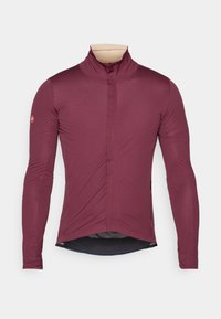 Langarm-Radtrikot in tiefem Burgunderrot, aus glattem Stoff mit hohem Kragen, Reißverschluss vorne und enganliegender Passform. Mit abgerundetem Saum.