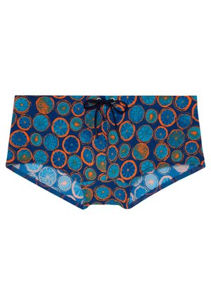 Blue swim trunks with orange and teal citrus slice patterns and a black drawstring at the front center.