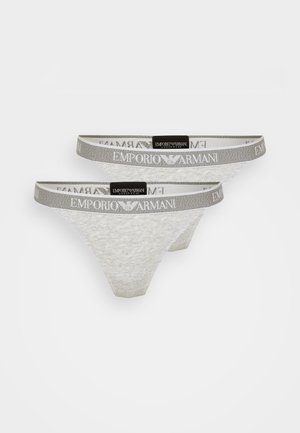 Two white lace thongs featuring a gray elastic waistband with "Emporio Armani" logo. Soft, sheer texture with a classic design.