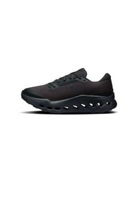 Scarpa sportiva nera con tomaia testurizzata, punta rotonda e suola spessa dotata di ritagli per maggiore flessibilità e ammortizzazione.