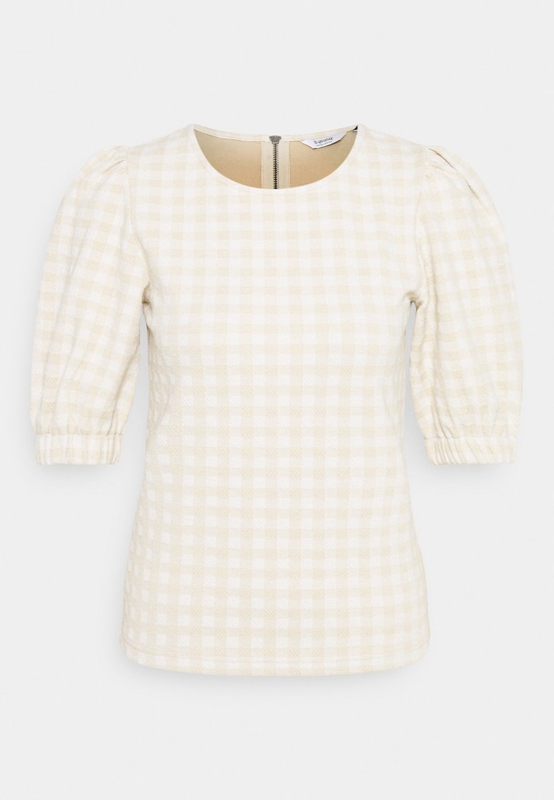 Top in gingham crema e beige con maniche corte a sbuffo, scollatura tonda e dettaglio con zip sul retro. Tessuto testurizzato con motivo a quadretti.