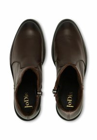 Brown leather ankle boots with a smooth finish, rounded toe, low heel, side zippers, and a textured insole featuring gold branding.