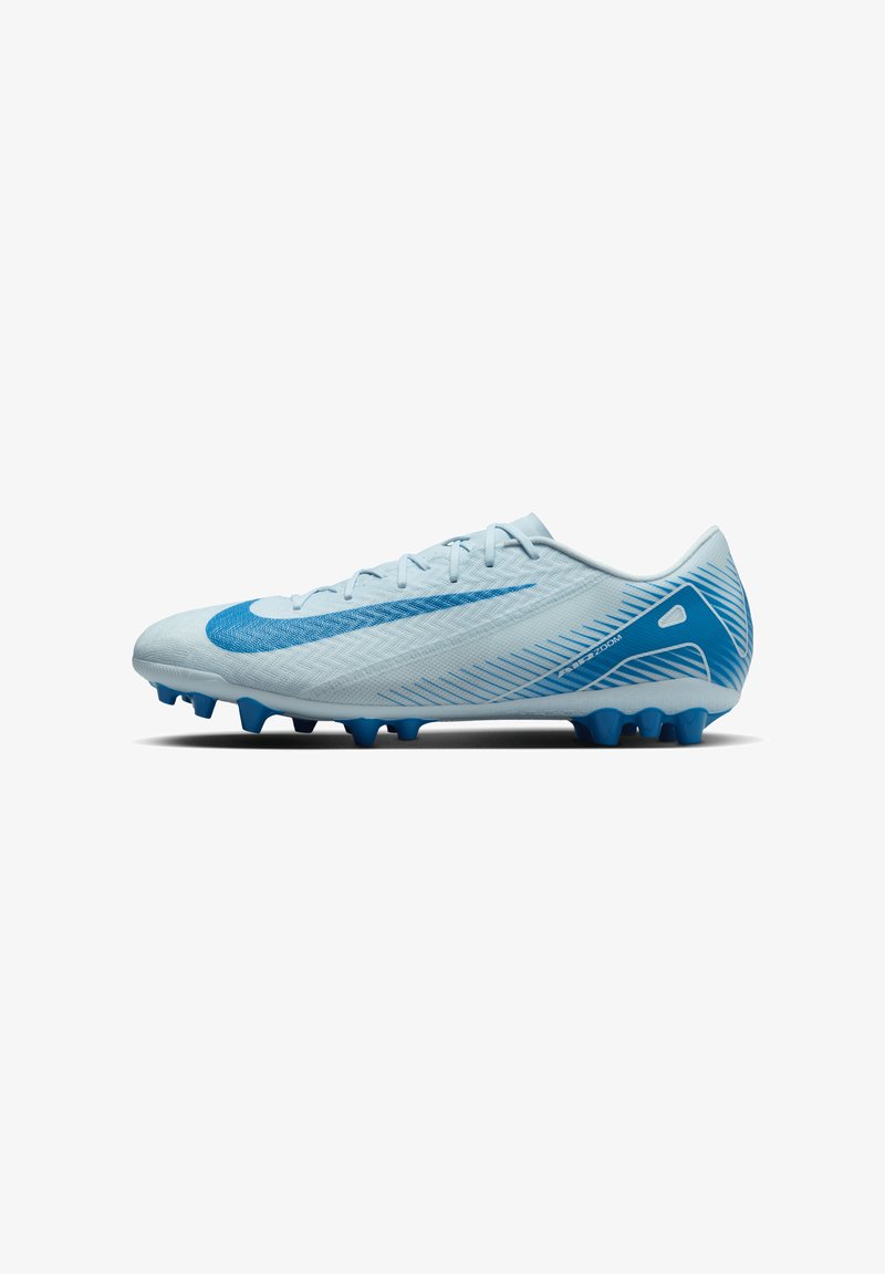 Light blue soccer cleats with a textured surface, featuring a prominent blue swoosh, and six blue studs on the sole for traction.