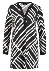 Schwarz-weißes Langarm-Tunika mit einem geometrischen Streifenmuster, einem runden Halsausschnitt und einer Knopfleiste mit drei Knöpfen.