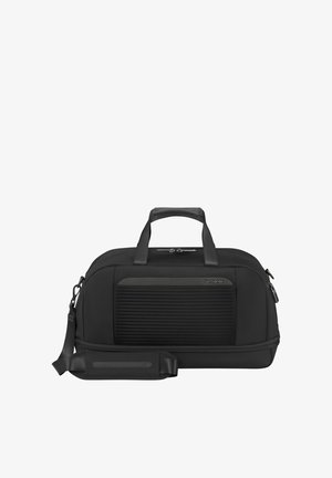 Black Samsonite duffel bag with top handles, adjustable shoulder strap, front zippered pocket, and a ribbed texture panel.