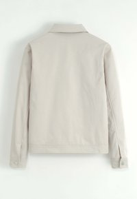 Veste longue beige clair à manches longues avec un col, des poignets boutonnés et sans embellissements visibles, montrée de dos sur fond blanc.