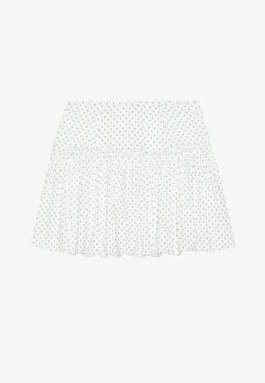 Gonna bianca con un design a strati, caratterizzata da pois neri. Realizzata in tessuto leggero con un orlo arricciato per una texture aggiuntiva.