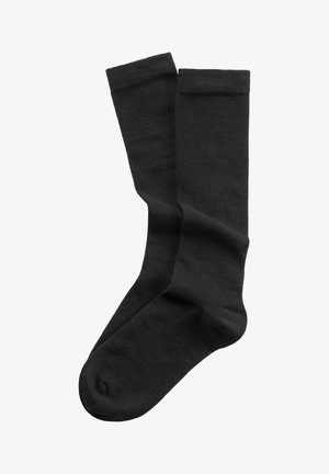 Calcetines de mezcla de algodón negros con una textura suave, longitud estándar y puños acanalados. Cuenta con una zona de puntera reforzada para mayor durabilidad.