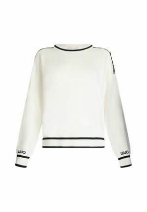 Maglione bianco con colletto e polsini a coste neri. Presenta un dettaglio con zip sulla spalla e un logo sulla manica. Tessuto morbido, design corto.