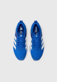 Blue mesh athletic shoes with white accents, featuring a textured upper, flat laces, and a cushioned sole. Branding on insoles visible.