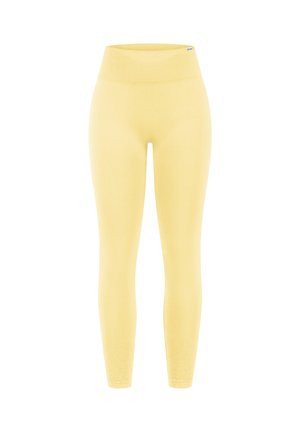 Naadloze gele legging met hoge taille en geribde tailleband, aansluitende stijl die tot aan de enkels reikt, zachte rekbare stof.