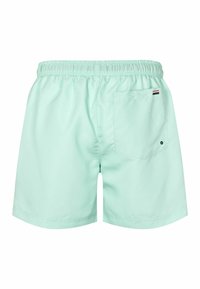 Mentazöld úszónadrág, elasztikus derékpánttal, hátsó zsebkendőzsebbe illeszkedő zsebbel és minimalista dizájnnal. Könnyű anyagból készült.