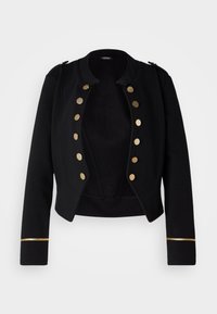 Veste noire courte avec des boutons dorés sur le devant et des bandes dorées sur les poignets des manches, dotée d'un col rond et d'épaulettes.