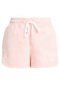Pink fleece shorts with a textured finish, elastic waistband, and white drawstring. Features a white Nike logo on the front.