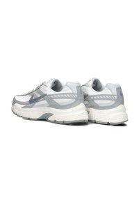Athletic shoes with a mesh upper in white and grey, featuring textured accents, a cushioned sole, and a supportive design.