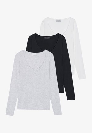 Set van drie langarmige shirts in lichtgrijs, zwart en wit. Voorzien van een V-hals en gemaakt van zachte, rekbare stof.