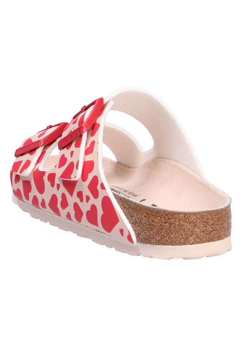 Infradito con motivo a cuore rosso e rosa, suola in sughero, apertura sul retro, cinturini in gomma e dettagli a fiocco sul davanti.