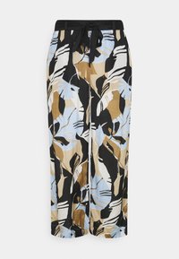Pantalon ample à motifs avec de grands motifs floraux abstraits en bleu, noir, beige et blanc, doté d'une taille élastique avec cordon noir.