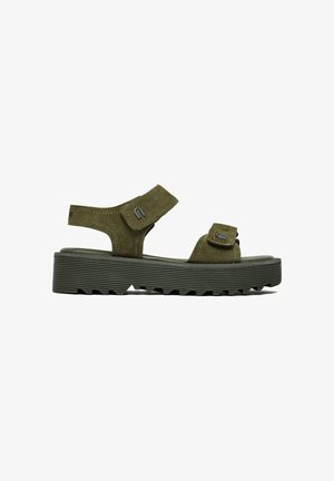 Olive green sporty sandal with thick ridged platform sole, adjustable ankle and toe straps, and suede-like texture.