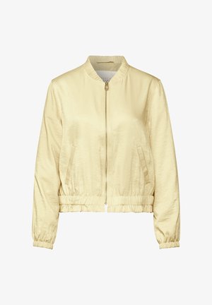 Chaqueta bomber de color amarillo claro con cremallera, puños y cinturilla elásticos, que cuenta con dos bolsillos laterales y una textura suave y brillante.