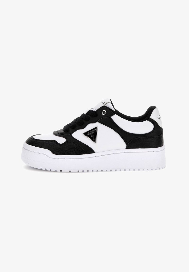 Black and white sneaker with a textured upper, featuring a logo plaque, lace closure, and thick white sole with a tread pattern.