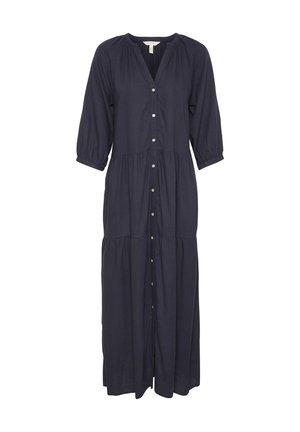 Tengerészkék, hosszú ujjú ruha gombos elülső résszel, redőzött vállakkal és fokozatosan hosszabbodó szegéllyel. Könnyű anyagból készült, puha tapintással.