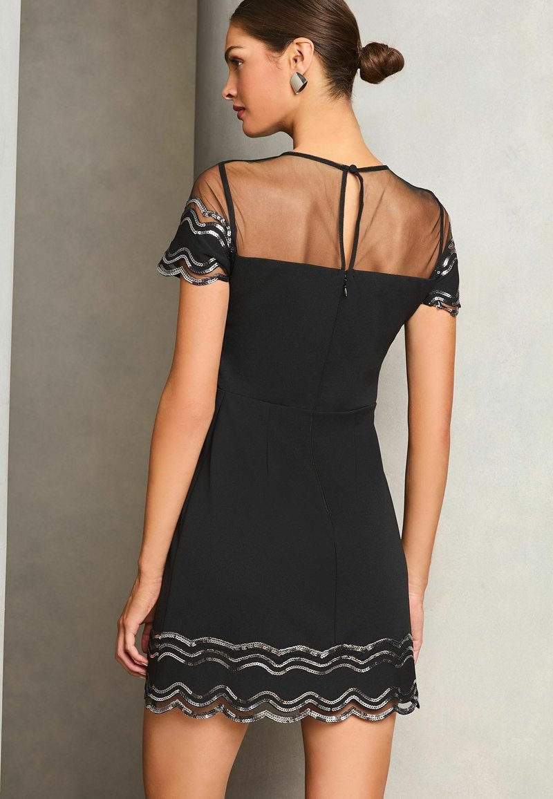 lipsy all over sequin scallop bodycon dress Buy Lipsy Yellow Pointelle Stitch Scallop Summer Midi Knit Dress from Next  USA