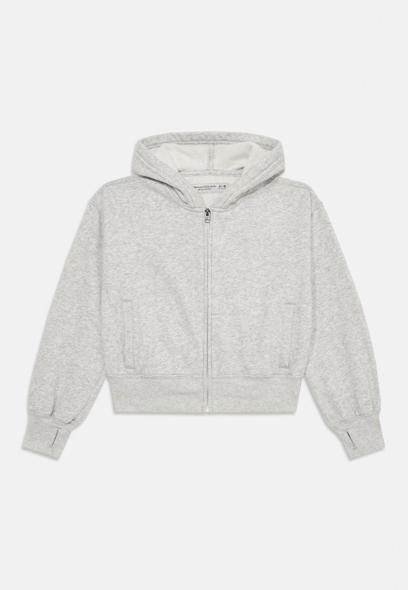 Sweatshirt zippé gris en tissu texturé, avec capuche et poches latérales. Présente des bords-côtes aux poignets et un design de bas échancré. Intérieur doublé.