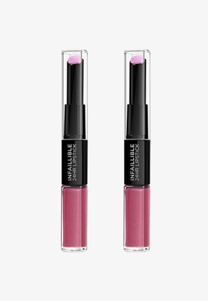 Duo de rouge à lèvres infaillible 24 heures avec tubes transparents. L'un a un embout en forme de bullet rose ; les deux présentent une base rose brillante avec des paillettes.