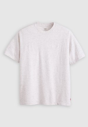T-shirt blanc à manches courtes en tissu doux, avec un subtil motif texturé et un petit logo à l'avant.
