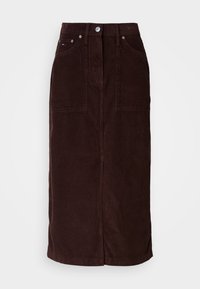 Gonna midi in velluto a coste marrone con taglio dritto, due tasche anteriori e cucitura centrale sul retro. Presenta una chiusura con bottone e zip.