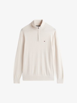 Sweat à zip couleur beige clair avec un col haut. Fabriqué en tissu doux, il présente des manches longues et un petit logo sur la poitrine.