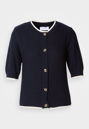 Cardigan de malha azul-marinho com mangas curtas, punhos em canelado e uma bainha cremosa. Apresenta cinco botões dourados à frente. Tecido texturizado.