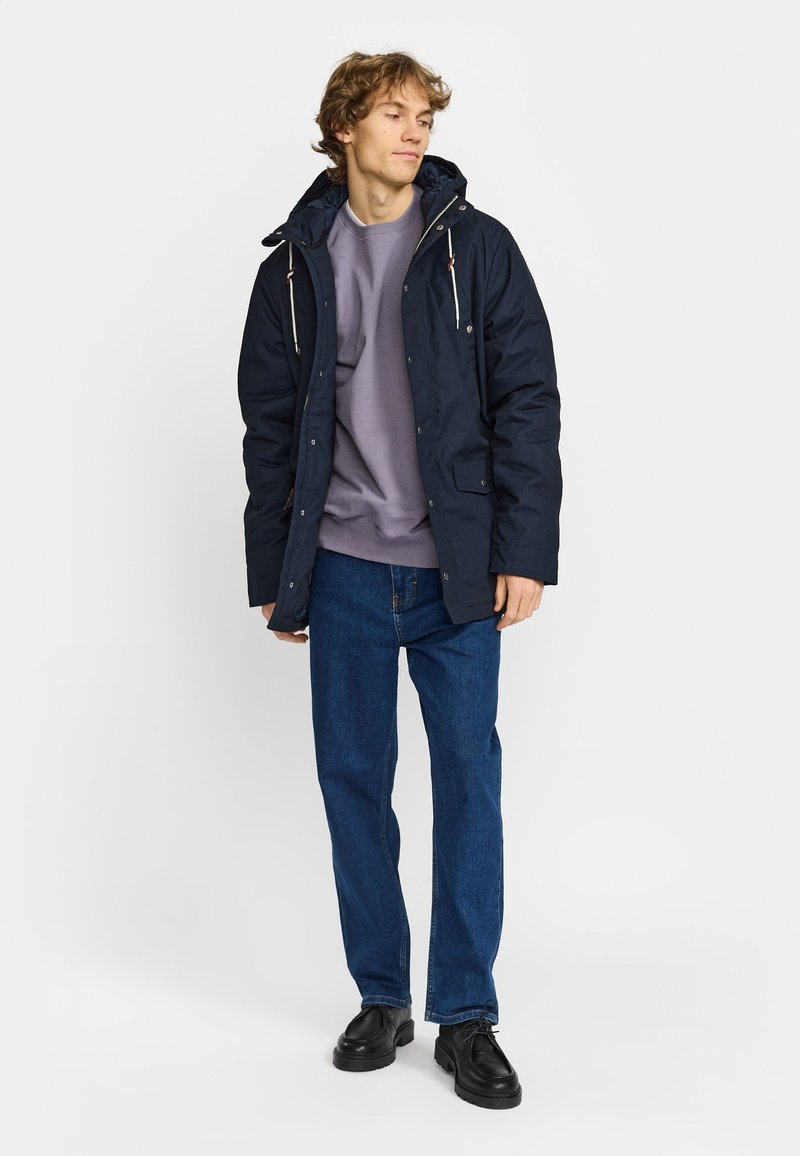 Comment choisir votre manteau imperméable | Blogue