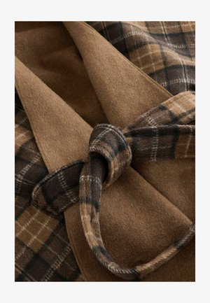 Brown wool fabric with a smooth texture, featuring a dark plaid pattern, tied with a matching belt, creating a layered look.