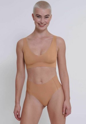 Nude bandeau-style bra and high-waisted underwear set, made from smooth, stretch fabric with a seamless design.