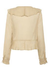 Beige blůza s dlouhým rukávem, rýškovým límcem a peplum spodním lemem, s kravátkovými manžetami a hladkým povrchem. Bez viditelných zapínání.