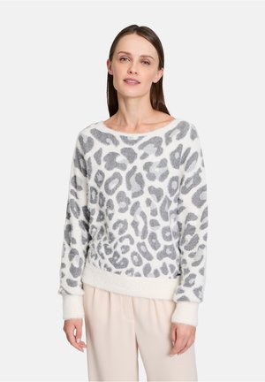 Grå och vit leopardmönstrad tröja med mjuk textur, vid halsringning och ribbade cuffs. Den nedersta kanten är något elastisk.