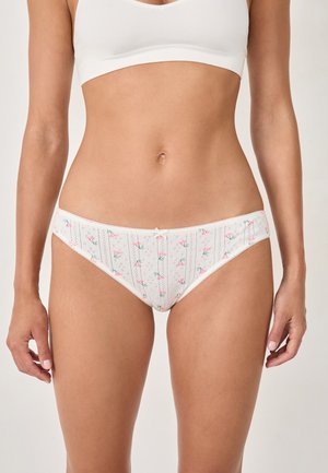 Mutande bianche con motivi floreali e righe verticali, realizzate in tessuto morbido, con un fiocco decorativo sul davanti e bordo in pizzo.