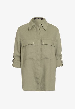 Lysegrøn linnedskjorte med spids krave, knaplukning foran, to brystlommer og opkrogede ærmer. Enkel, afslappet design.