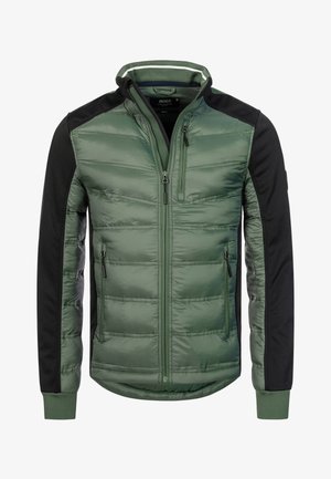 Green puffer jacket with black sleeves, zippered pockets, and a high collar. Features quilted texture and a fitted silhouette.