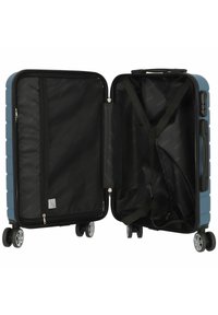Harde koffer in het blauw met een gestructureerde buitenkant. Binnenin beschikt hij over een zwarte voering, een mesh-pocket en verstelbare banden. Vier wielen voor mobiliteit.