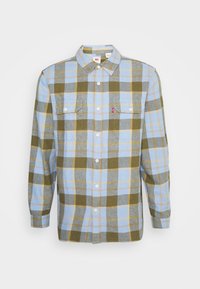 Camicia in flanella con motivo a quadri blu, verde e giallo. Presenta un colletto, chiusura con bottoni e due tasche sul petto. Materiale in cotone, maniche lunghe.