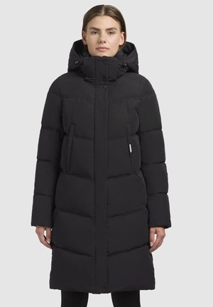 Long black puffer coat with a hood, featuring quilted sections, snap buttons, and side pockets. Smooth texture, knee-length design.