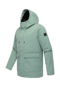 Chaqueta con capucha de color verde claro, hecha de un tejido suave y liso, con dos bolsillos frontales y una pequeña etiqueta negra en la manga.