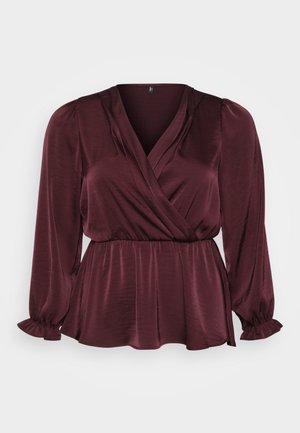 Burgundia blouse, millede disain, pikad varrukad ja volangäär. Sile kude kerge läikega, esitatud lihtsal taustal.